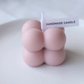 Pink bubble cube handmade candle on a white ceramic plate with a minimal aesthetic - Grey Pink (Garden Kiss)