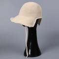 Detail of cream knitted sun hat featuring breathable texture and wide brim with chin straps - M(56-58cm) / Beige