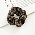 Elegant leopard print scrunchie with metallic sheen in black and bronze fabric - Black & Gold Leopard