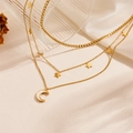 Three-layer gold titanium necklace featuring celestial star and crescent moon pendants - Star and Moon Triple Layer Style (O401)