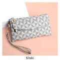 Detail of khaki geometric patterned wristlet bag with golden zipper and drip-shaped puller - Khaki