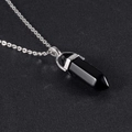 Macro shot of a polished black obsidian hexagonal prism pendant on a silver-toned chain - Pendant + Chain Set / Obsidian