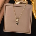Elegant gold four-leaf clover necklace with sparkling zircon charms in a jewelry box - Clover (8305)