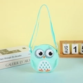 Close-up of cute mint green owl plush crossbody bag with glitter eyes on a soft desktop - Mint Green