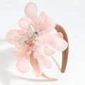Close-up of pink tulle flower headband with detailed rhinestone and gold filament stamen - Orange Pink