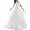 Detail of elegant lace patchwork and sheer long sleeves on a deep V-neck white bridal gown - US 2 / Floor-Length