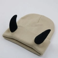 Beige knitted beanie with black devil horns for a fun and warm winter style - Adult One Size - Elastic / Black Horn - Beige Hat