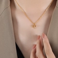 Gouden Ram sterrenbeeld ketting met zirkonia steentjes aan een fijne titanium stalen ketting - Ram - Goud / 40+5cm