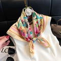 Tropical floral silk scarf in bright yellow with pink flowers on a stylized hanger - 60 Square Scarves / 65