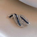 Detailed close-up of a vintage feather brooch with silver plating and blue rhinestones - 6# Silver - Blue