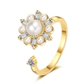 Detailed macro shot of rotatable flower ring with large pearl and crystal petals - Gold Snowflake Pearl Rotating