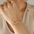 Golden blade chain bracelet with square clear zircon gem worn by female model - Champagne Zirconia Gold Bracelet (E377)