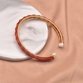 Red bamboo-shaped bracelet with gold wire weaving and pearl ends on silk background - Coral Set Bangle (GB0193)