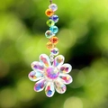 Macro shot of crystal sunflower suncatcher with multifaceted beads and rainbow shine - Single Flower Colorful Beads