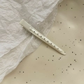 Detail of off-white matte duckbill hair clip with unique hollow circular pattern - 9cm Positioning Clip / White
