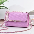 Purple woven tote bag with gold chain and pearl charm in a stylish lifestyle setting - With Pendant / Large / Purple