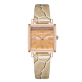 Macro detail of square rose gold watch case with gradient orange dial and beige leather strap - Gold