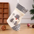 White knitted Christmas stocking with gray snowman applique and festive plaid cuff decor - Snowman