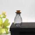 Mini oval glass wishing bottle in smoky gray finish with a natural cork stopper - Grey Oval Bottle With Cork