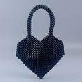 Handmade black pearl beaded heart-shaped handbag with glossy finish and top handle - Black