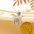 Silver bow stud earrings with pink zircon stone on a decorative ceramic plate - Silver Bowknot Pink Zirconia Single Piece (A397)