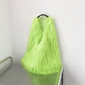 Neon green faux fur tote bag with black handles displayed on a metal wire rack - Fluorescent Green