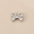 Macro view of a silver bow pendant with cubic zirconia inlay for DIY jewelry design - PJ0240-Silver (Bowknot)