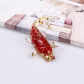 Red resin koi fish figurine with gold foil flakes for office desk decoration - Deep Sea Caterpillar