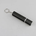 Macro detail of black rhinestone-studded perfume spray bottle with keychain hook - Black