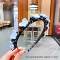 Diadema negra para niña de 11,3 cm con pinzas de flores azules decorativas - Mariposa Azul