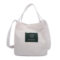 Borsa a secchiello in tela bianco sporco con toppa verde e tracolla regolabile - Bianco