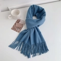 Flat lay of soft blue cashmere-style knitted scarf with tassels and coffee cup - Regular Fit / Sky Blue