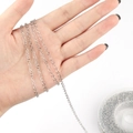 Macro view of silver stainless steel round cable chain on spool for DIY jewelry making - Steel-colored Round Chain / 2mm (5 Yards Per Roll)