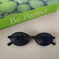 Classic oval children's sunglasses with black frames and dark lenses for UV protection - Black and Gray