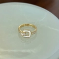 Golden enamel ring featuring a square white shell inlay and sparkling small diamonds - Mother of Pearl Square Buckle