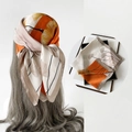 Satin floral silk scarf featuring beige and orange ginkgo leaf patterns in elegant drape - L7213-Ginkgo Leaf Orange
