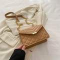 Quilted khaki crossbody bag with gold chain strap on beige blazer background - Khaki