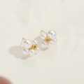 Elegant pearl flower earrings with gold base and green gemstone center in a detailed shot - ES2553 Flower Pearl