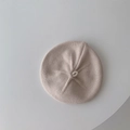 Close-up detail of the cream knit texture and top knot design on the baby beret hat - 45-48cm (6 Months-3 Years) / Beige