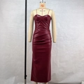 Detail of burgundy PU leather corset dress featuring ruched design and bodycon fit - S / Burgundy