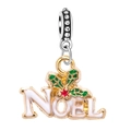 Detail of Christmas Noel enamel charm with green holly leaves and red berry accent - Christmas NOEL