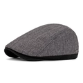 Classic British newsboy cap in grey textured fabric with black trim and side metal logo - Light Gray