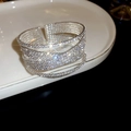 Macro shot of silver crisscross bangle with sparkling zircon and layered open design - 1# 10-Layer Silver Cross Bangle
