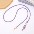 Detail van paarse denim geweven crossbody riem met verstelbare gouden metalen gespen - Verstelbare Crossbody / Paars