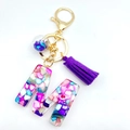 Letter M resin keychain with purple tassel, colorful stone inlay and golden lobster clasp - M