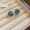 Macro shot of green resin round earrings with silver frame in a velvet jewelry box - Silver-Green-Square Hemisphere