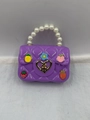 Purple mini jelly handbag with pearl handle and colorful cartoon charms for girls - Purple