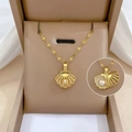 Elegant 18k gold shell pendant necklace with a white pearl and detailed tile chain - Gold Pearl Shell