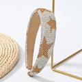 Detail van de fonkelende zilveren strass hoofdband met gouden sterren op een standaard - Strass Lichtkoffie Ster
