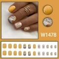 Autumn themed yellow and white press-on nails with leaf patterns and flower designs - W1478 Autumn Leaves Yellow (Glue Style)